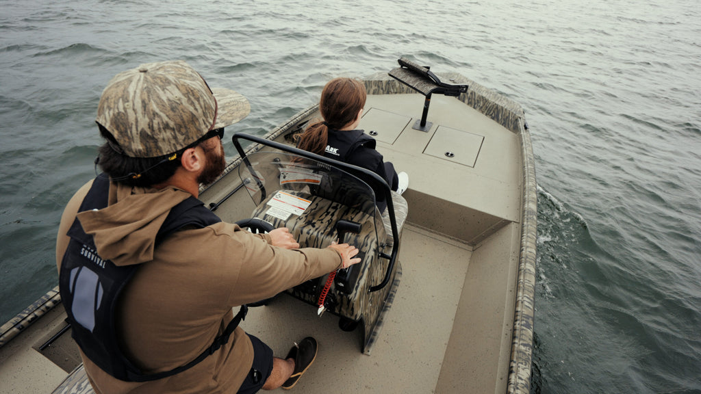SeaArk Shadow 18 — manufacturer photo, anglers fishing from the boat