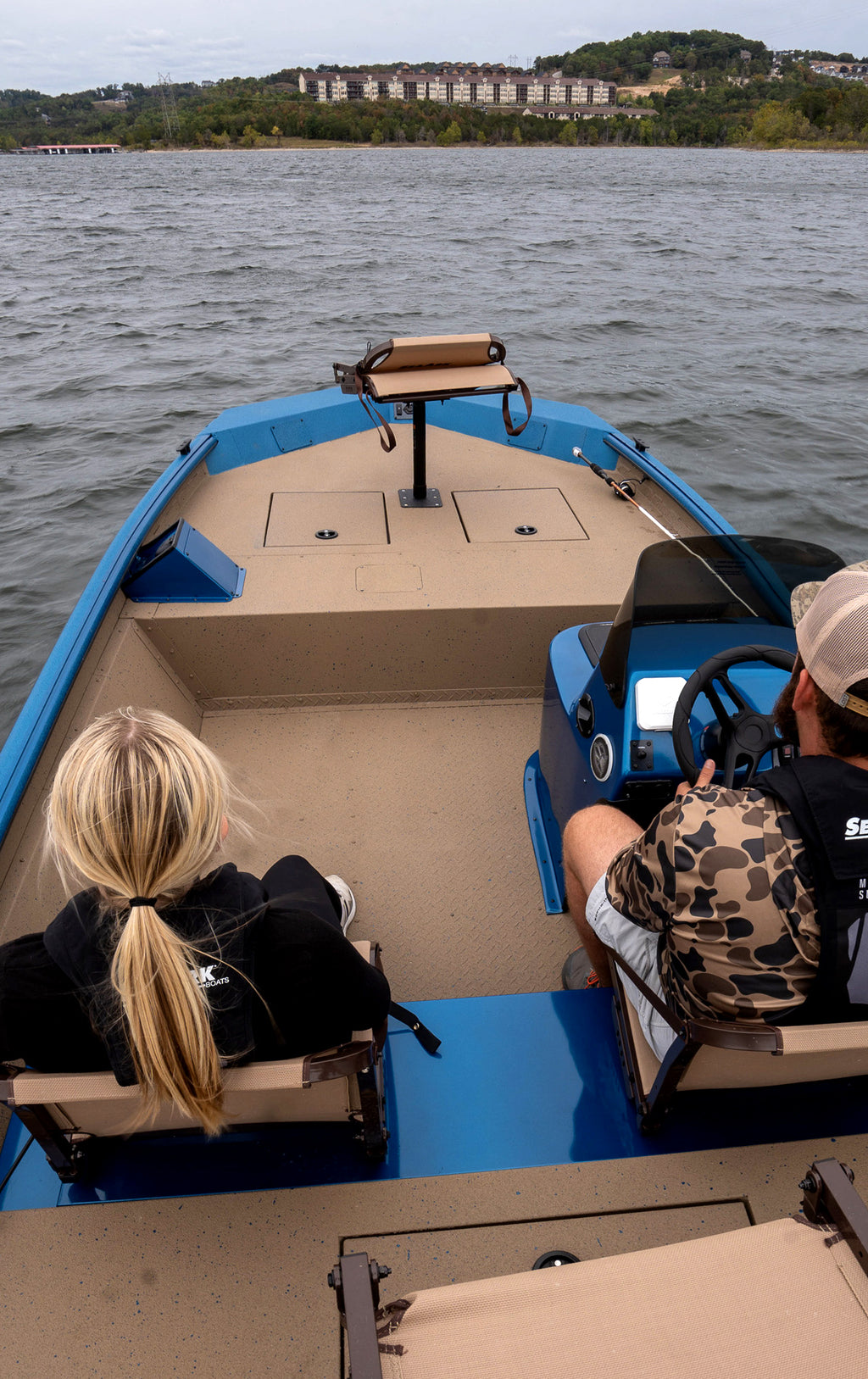 SeaArk Shadow 18 — manufacturer photo, anglers aboard on the water