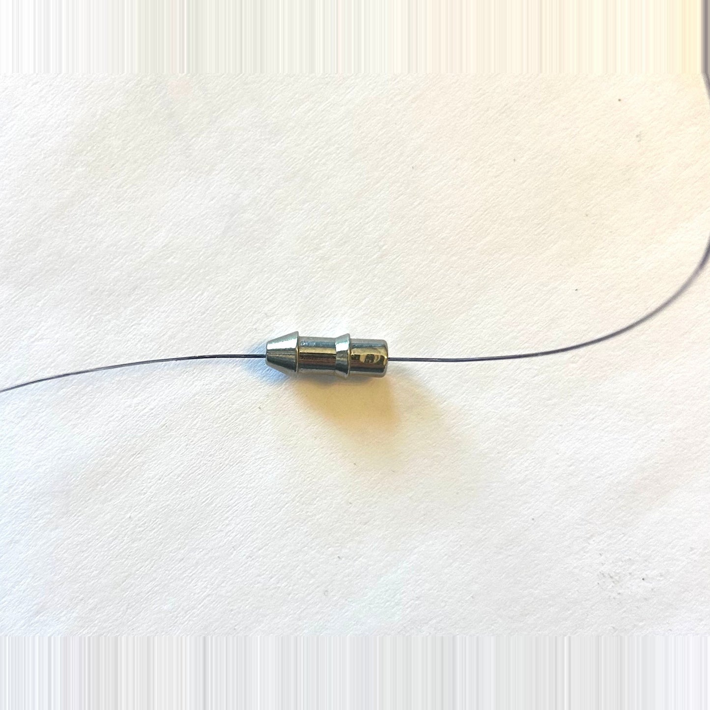 Queen Tackle line-through tungsten nail weight rigged on line ahead of a bait